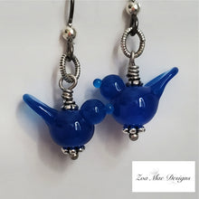 Load image into Gallery viewer, Blue Bird Earrings hanging.
