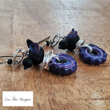 Load image into Gallery viewer, Nested Bird on Gear Earrings (Black and Purple)

