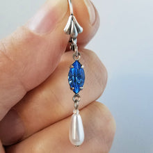Load image into Gallery viewer, Vintage Faux Pearl and Sapphire Crystal Earrings held in hand.
