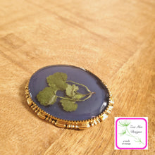 Load image into Gallery viewer,  Navy with Leaves Convertible Brooch Pin on wooden background.
