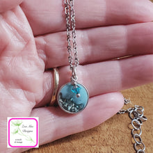 Load image into Gallery viewer, Antique Silver Mini Glitter Necklace held in hand.
