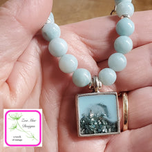 Load image into Gallery viewer, Antique Silver Gemstone and Glitter Necklace held in hand.
