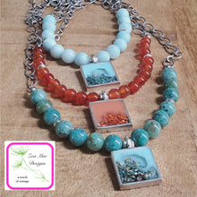 Load image into Gallery viewer, Antique Silver Gemstone and Glitter Necklaces on wooden background.
