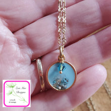 Load image into Gallery viewer, Antique Gold Mini Glitter Necklace held in hand.
