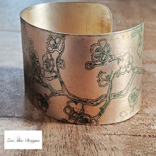 Load image into Gallery viewer, Cherry Blossom Etched Brass Cuff right side view.
