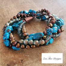 Load image into Gallery viewer, Turquoise Twist Necklace coiled on wooden background.
