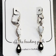 Load image into Gallery viewer, Vintage Milk Glass Crystal and Jet Swarovski Earrings on earring card.
