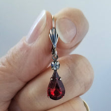 Load image into Gallery viewer, Vintage Ruby and Clear Crystal Earrings held in hand.
