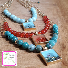Load image into Gallery viewer, Antique Gold Gemstone and Glitter Necklaces on wooden background.
