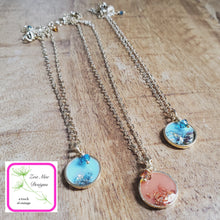 Load image into Gallery viewer, Antique Gold Mini Glitter Necklaces on wooden background.

