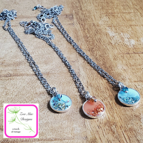 Antique Silver Mini Glitter Necklaces on wooden background.