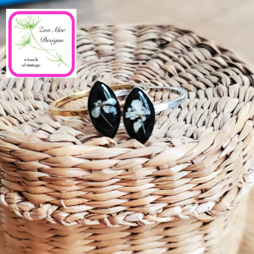 Queen Anne's Lace Marquise Stacking Rings sitting on basket.